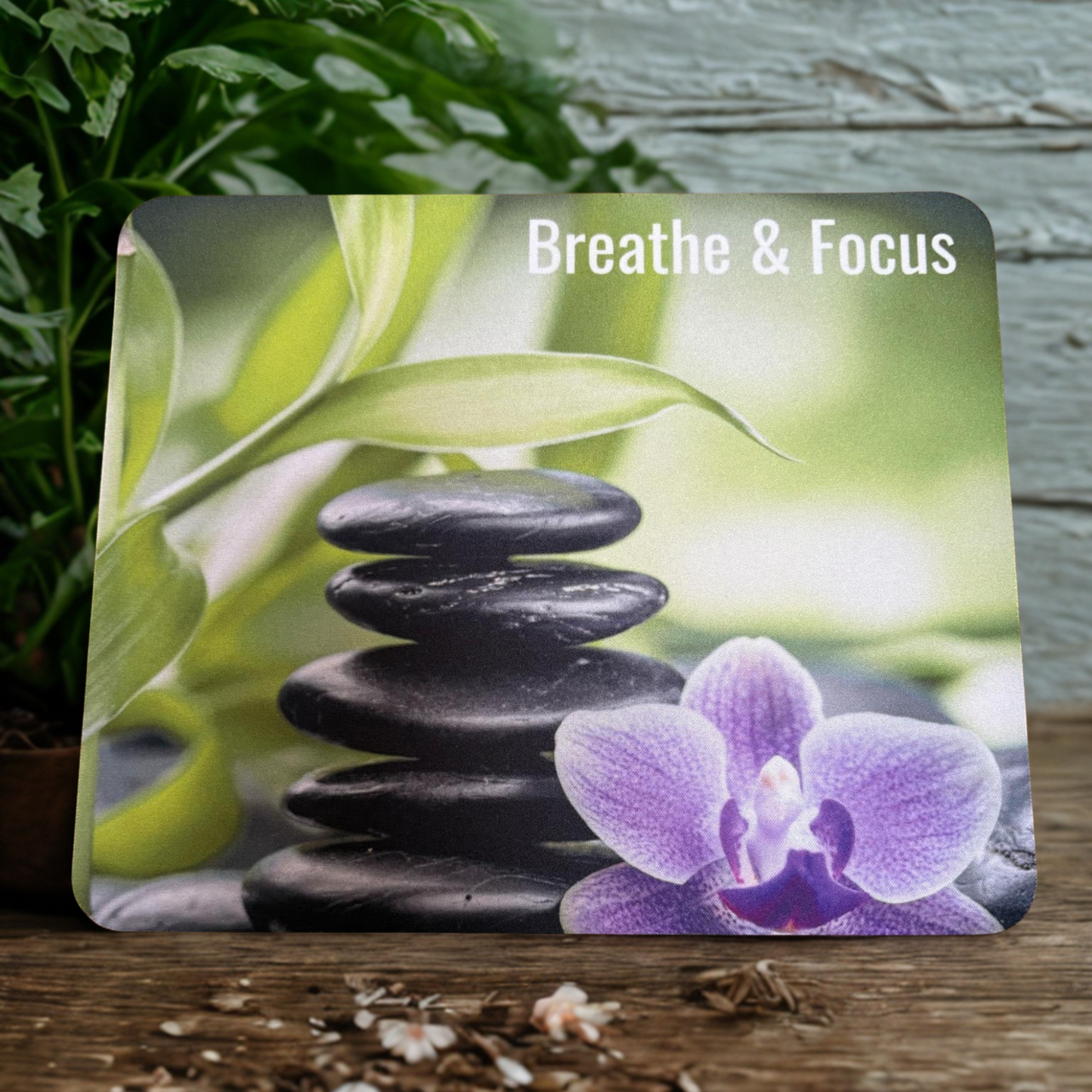 Affirmation Mouse pad with text "Breathe & Focus", with orchid, and a rose quartz cluster