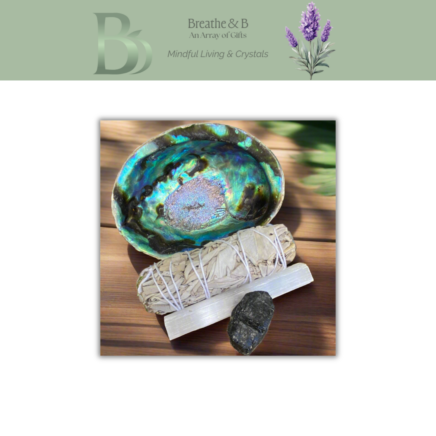 Sage bundle, crystal, and abalone shell on a wooden surface with 'Breathe & B' branding.