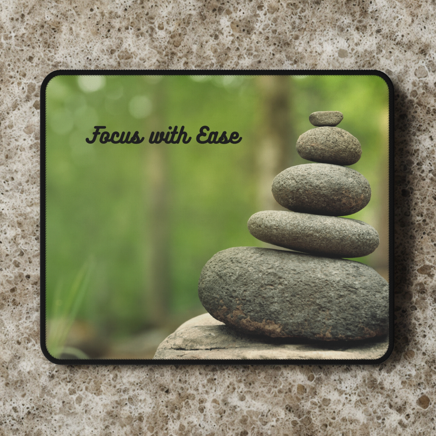 "Focus with Ease' themed mouse pad with a balancing stone design.
