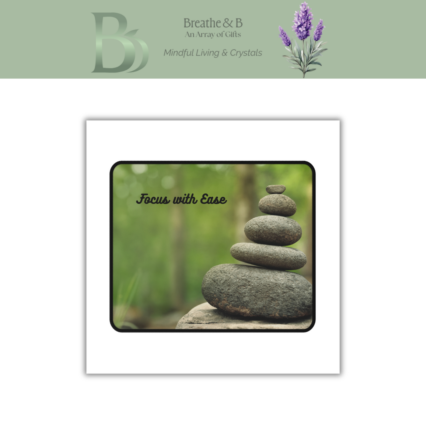 Balancing stones with 'Focus with Ease' text on a mouse pad in a nature setting