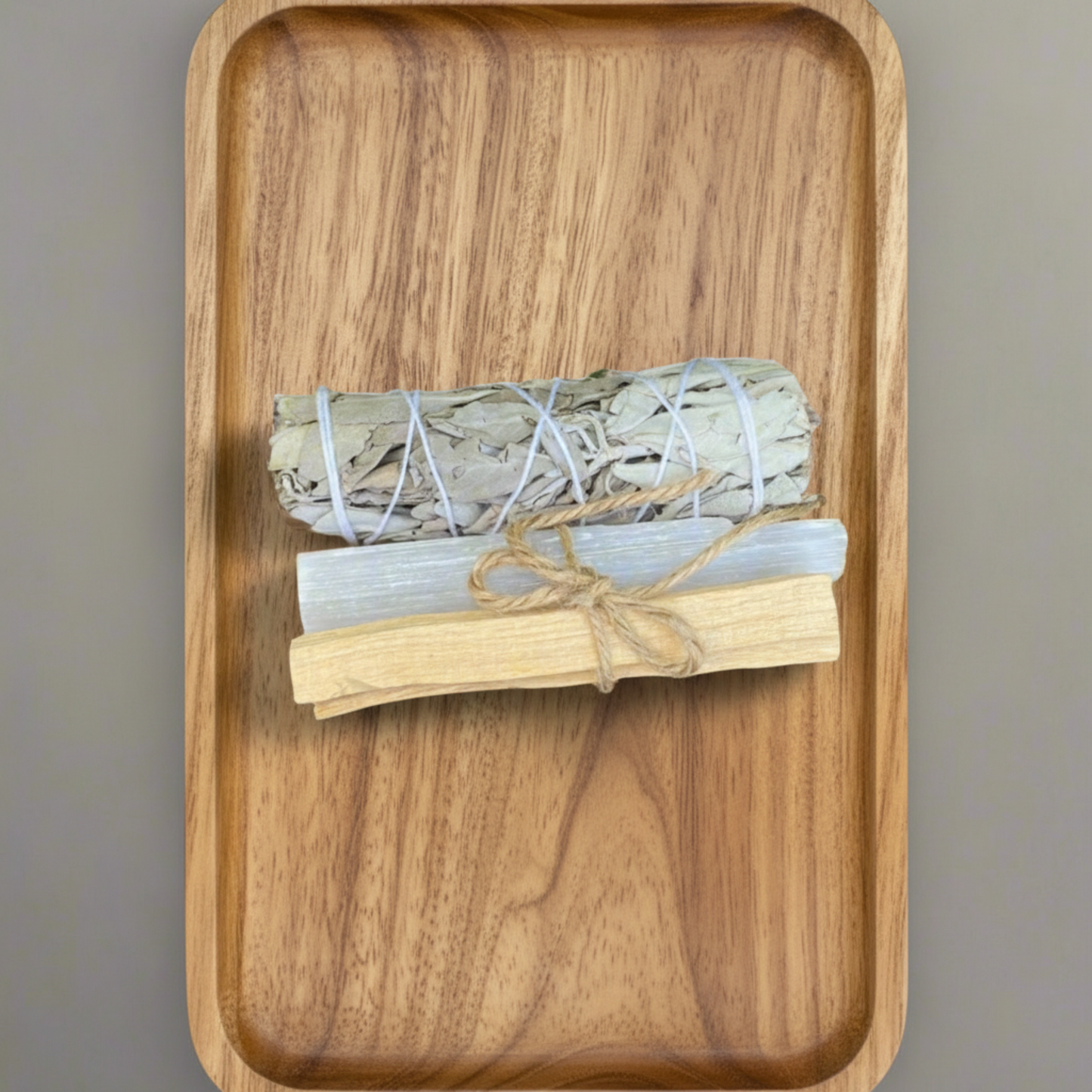 Sage, Palo Santo Stick and Selenite Rod on a wooden tray