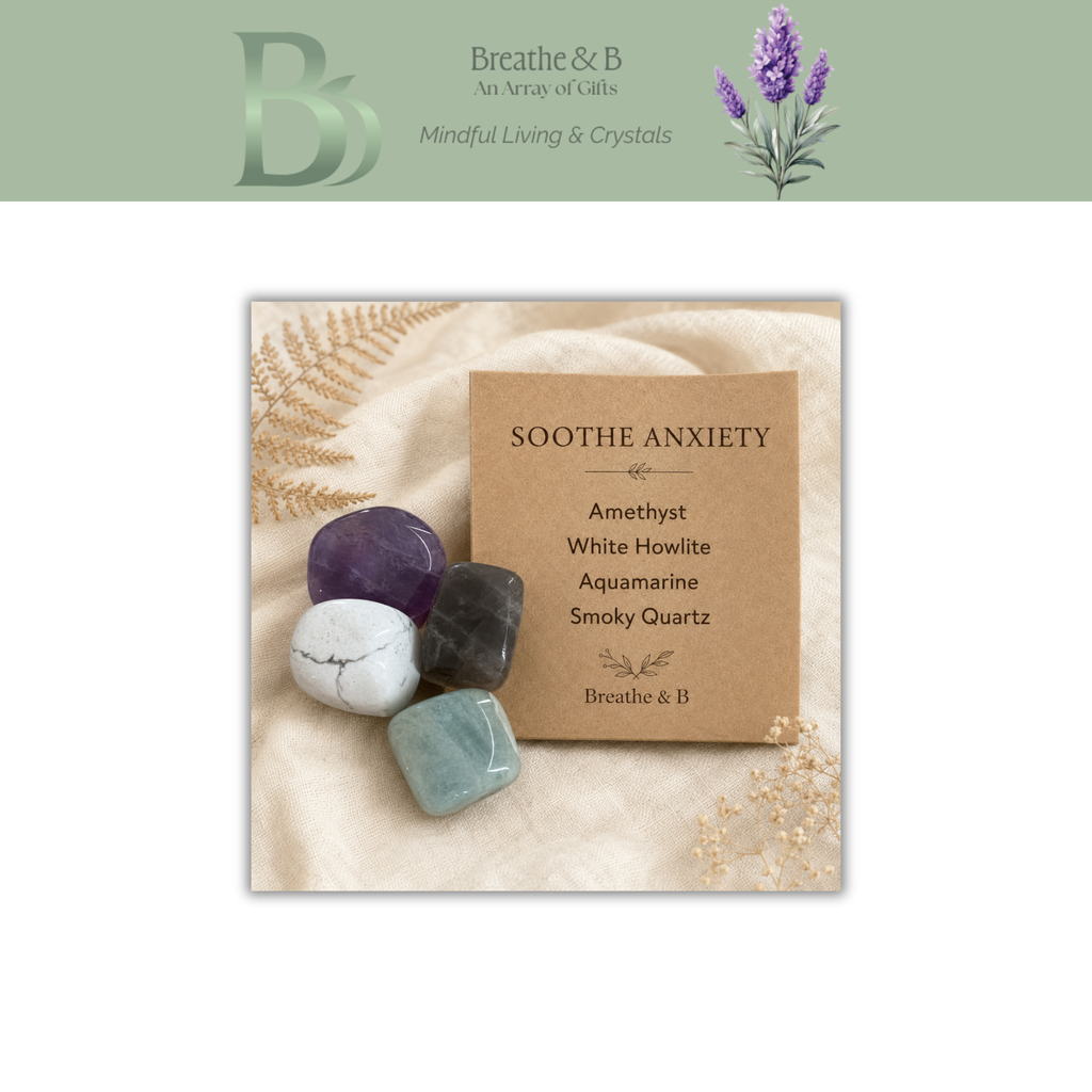A square product card from Breathe & B, featuring four polished crystals (amethyst, white howlite, smoky quartz, and light blue) on a beige fabric background next to a kraft paper label that reads 'SOOTH THE ANXIETY'. The top of the image has a sage green banner with the Breathe & B logo and lavender illustration.