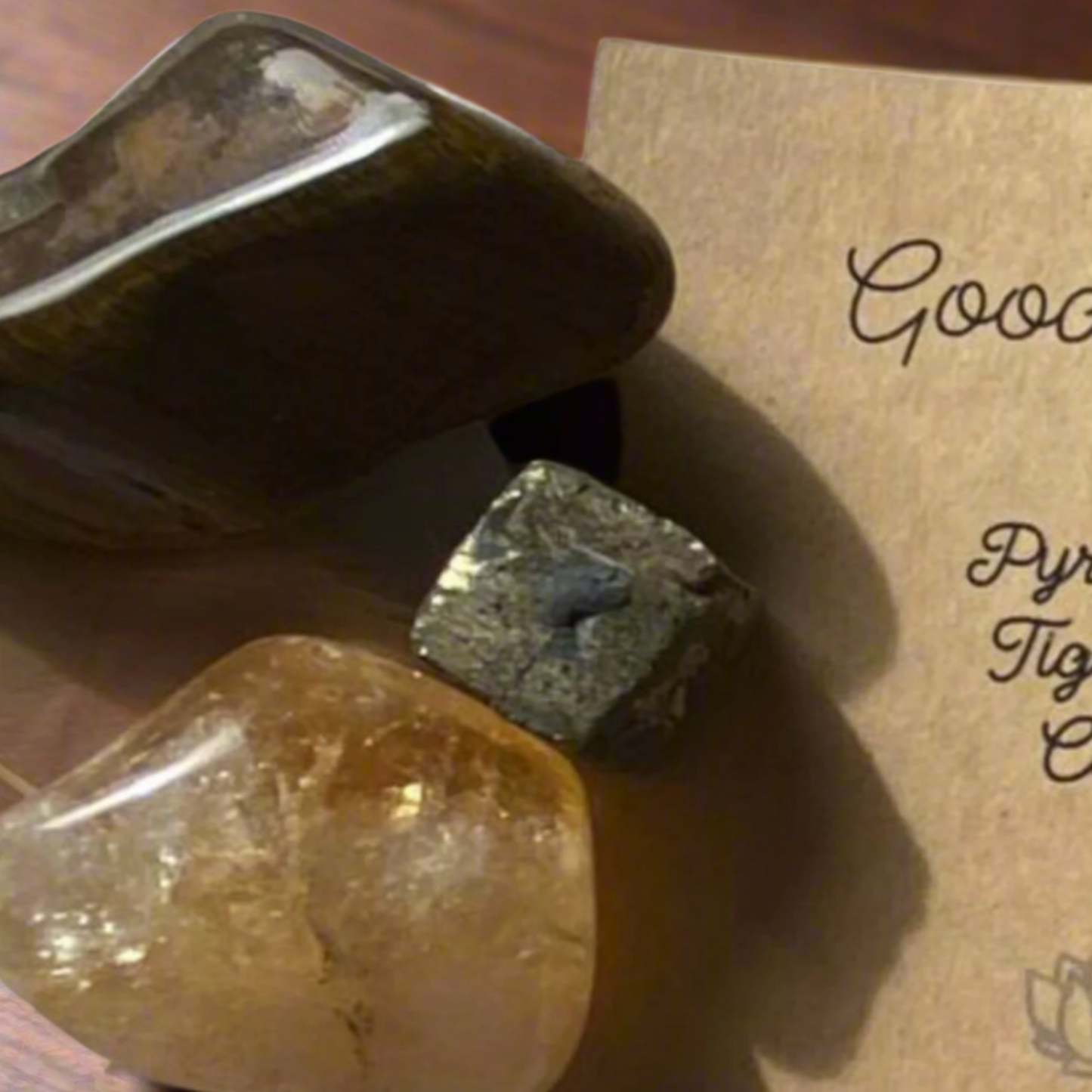 Close up collage of pyrite cube, citrine and tiger's eye crystals included in the kit