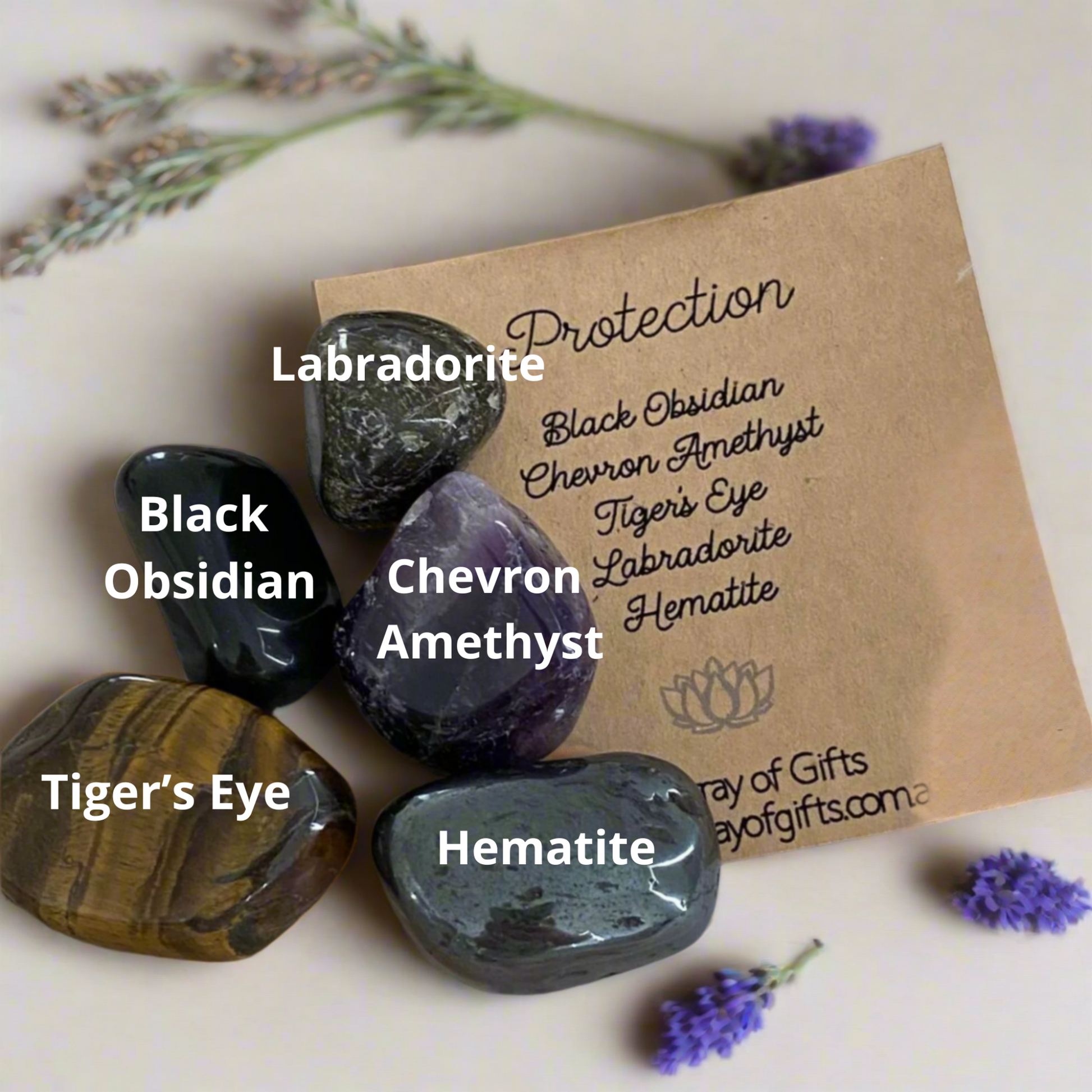 Protection crystal kit showing labelled tumble stones for grounding and energy support