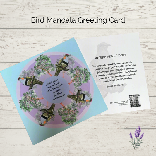 Bird mandala greeting card on a wooden surface with a leaf graphic.