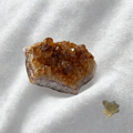Natural raw citrine cluster close-up showing soft yellow tones,