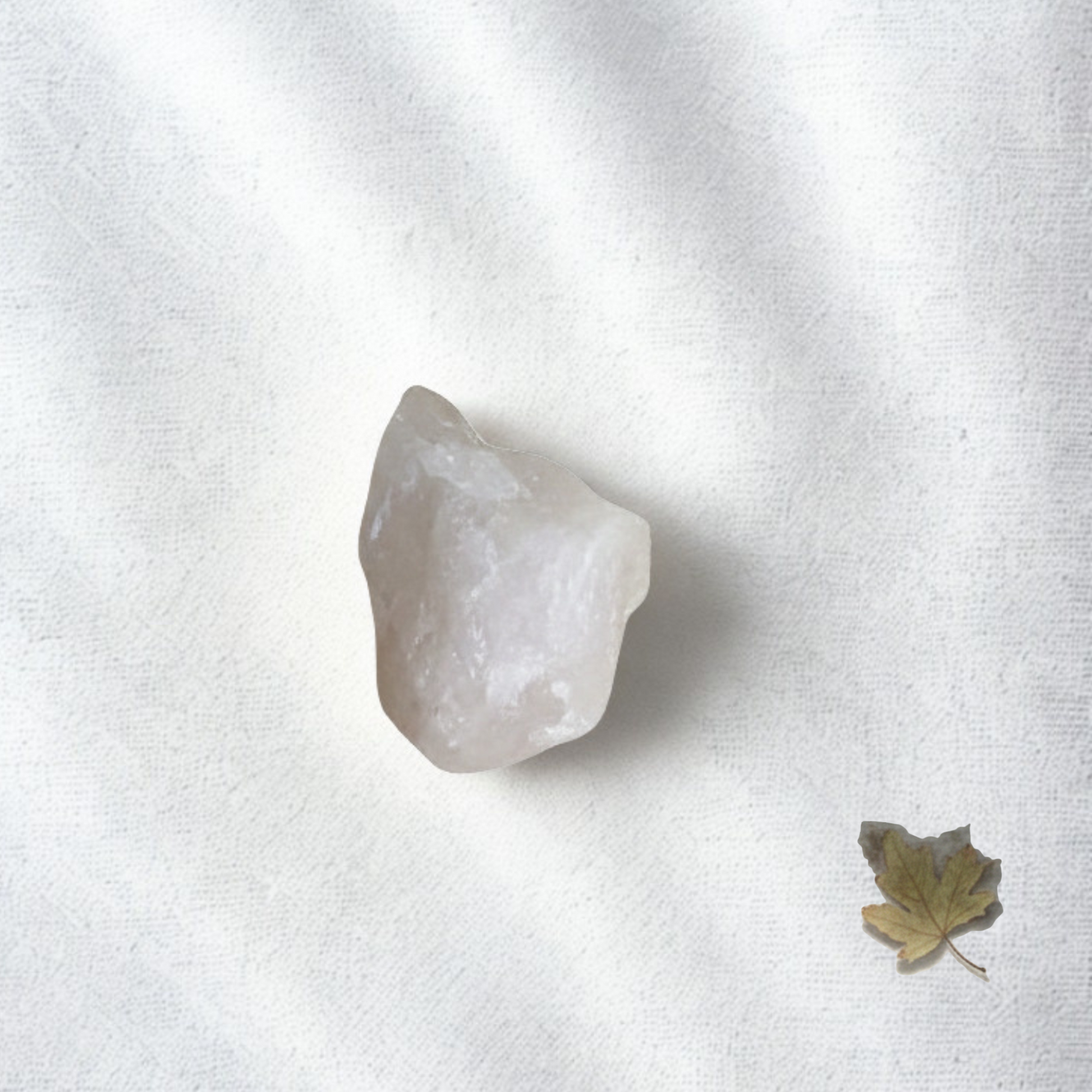 Natural raw rose quartz cluster close-up showing soft pink tones, used for emotional healing, self love and heart chakra balance