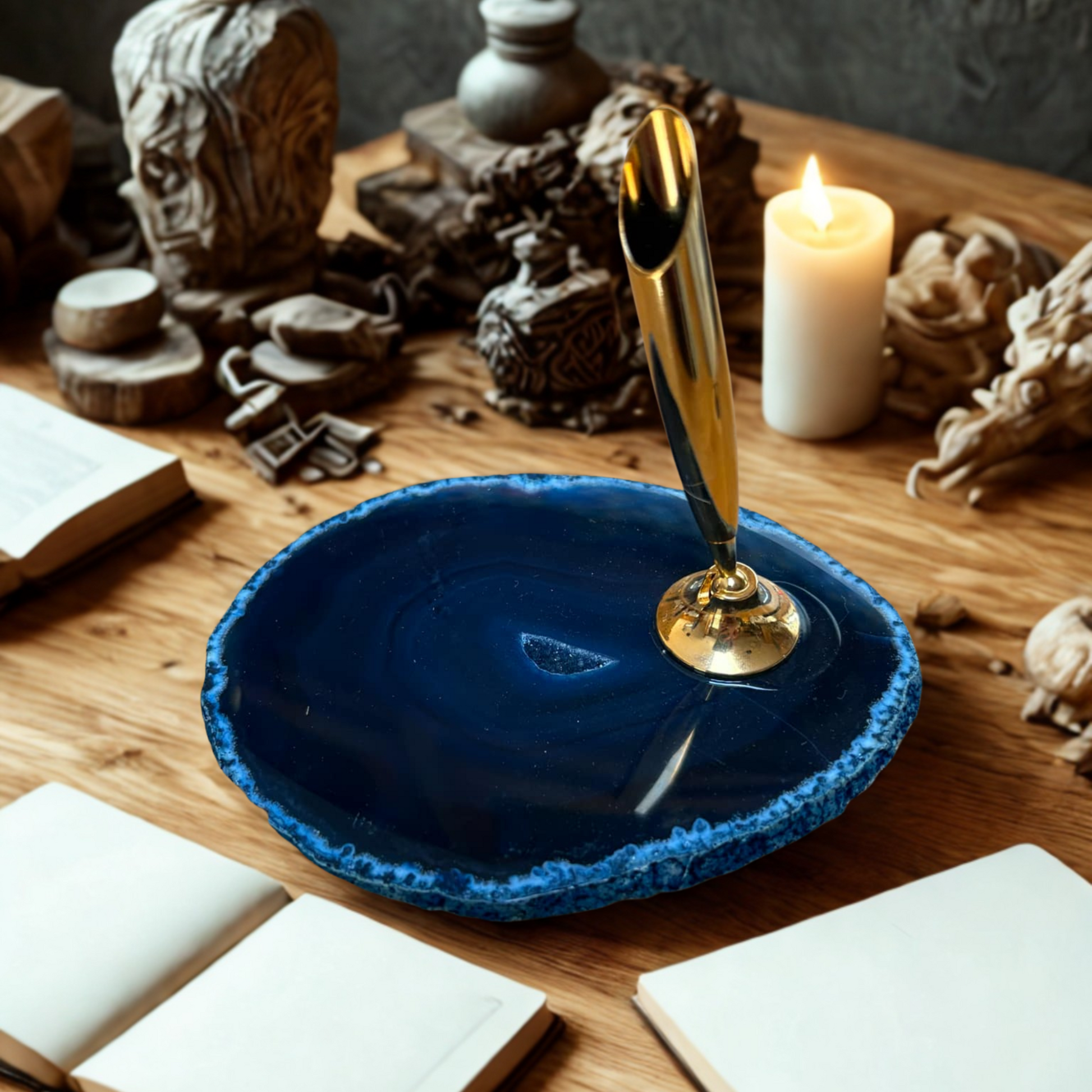 Blue agate slice with pen holder on a wooden surface with decorative items.