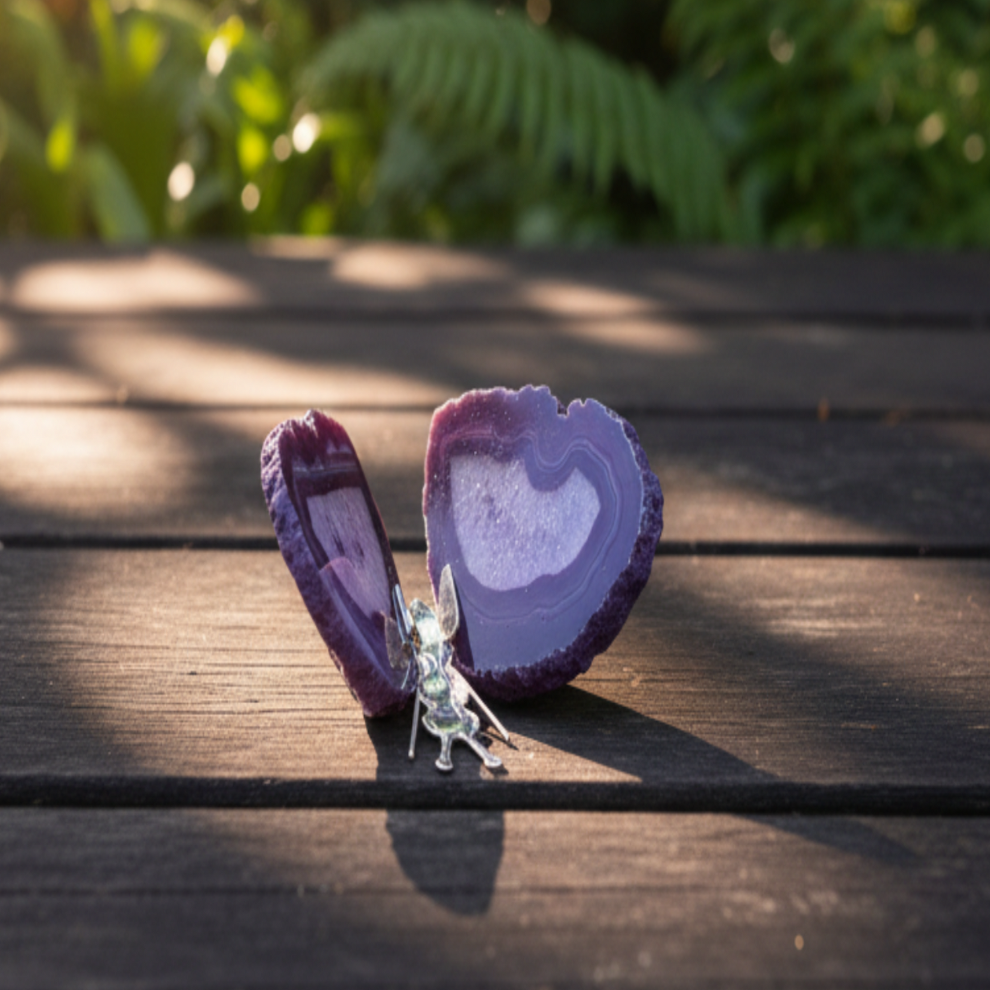 Purple agate butterfly on a wooden surface outdoors