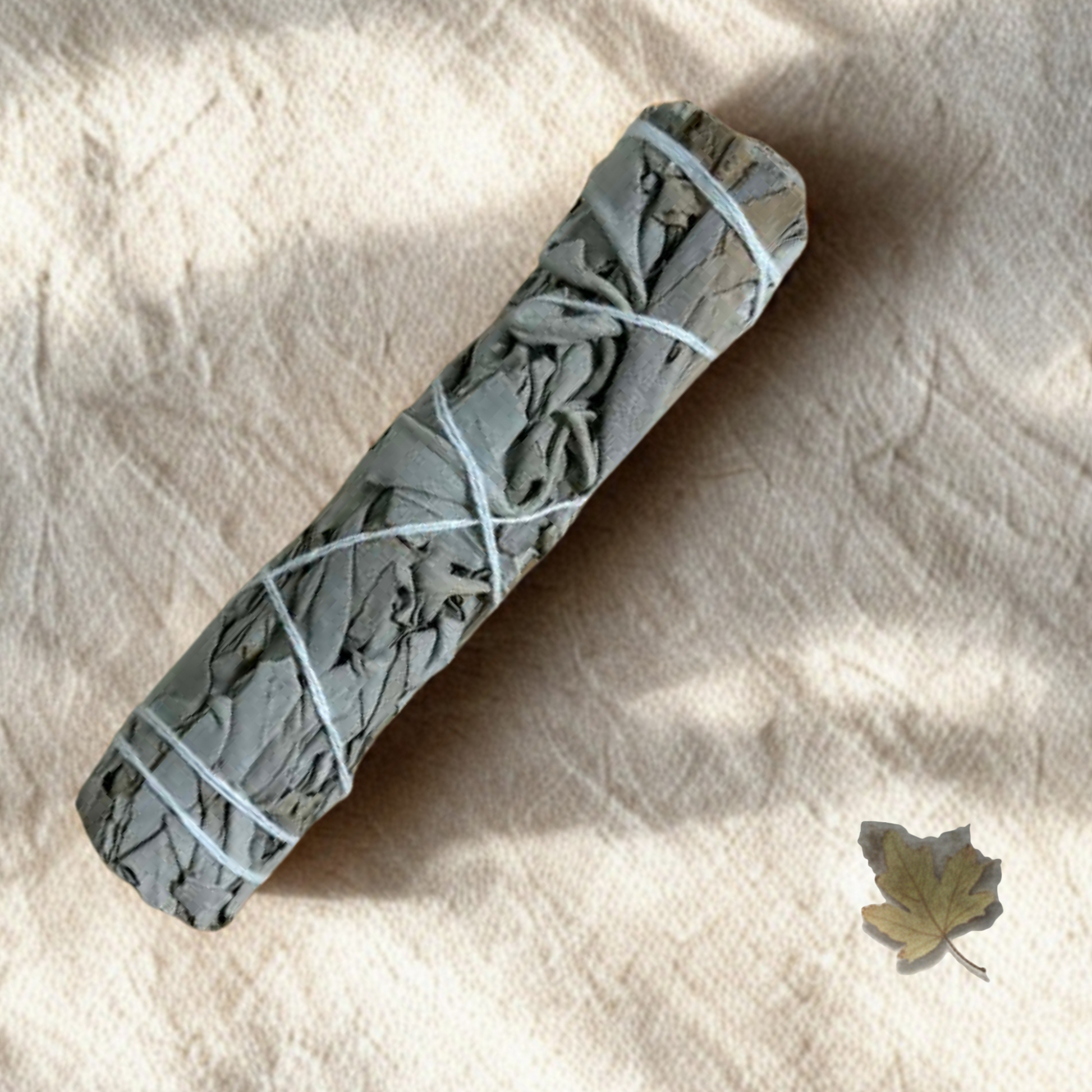 Natural dried sage smudge stick tied bundle used for energy cleansing, spiritual purification and mindfulness rituals.