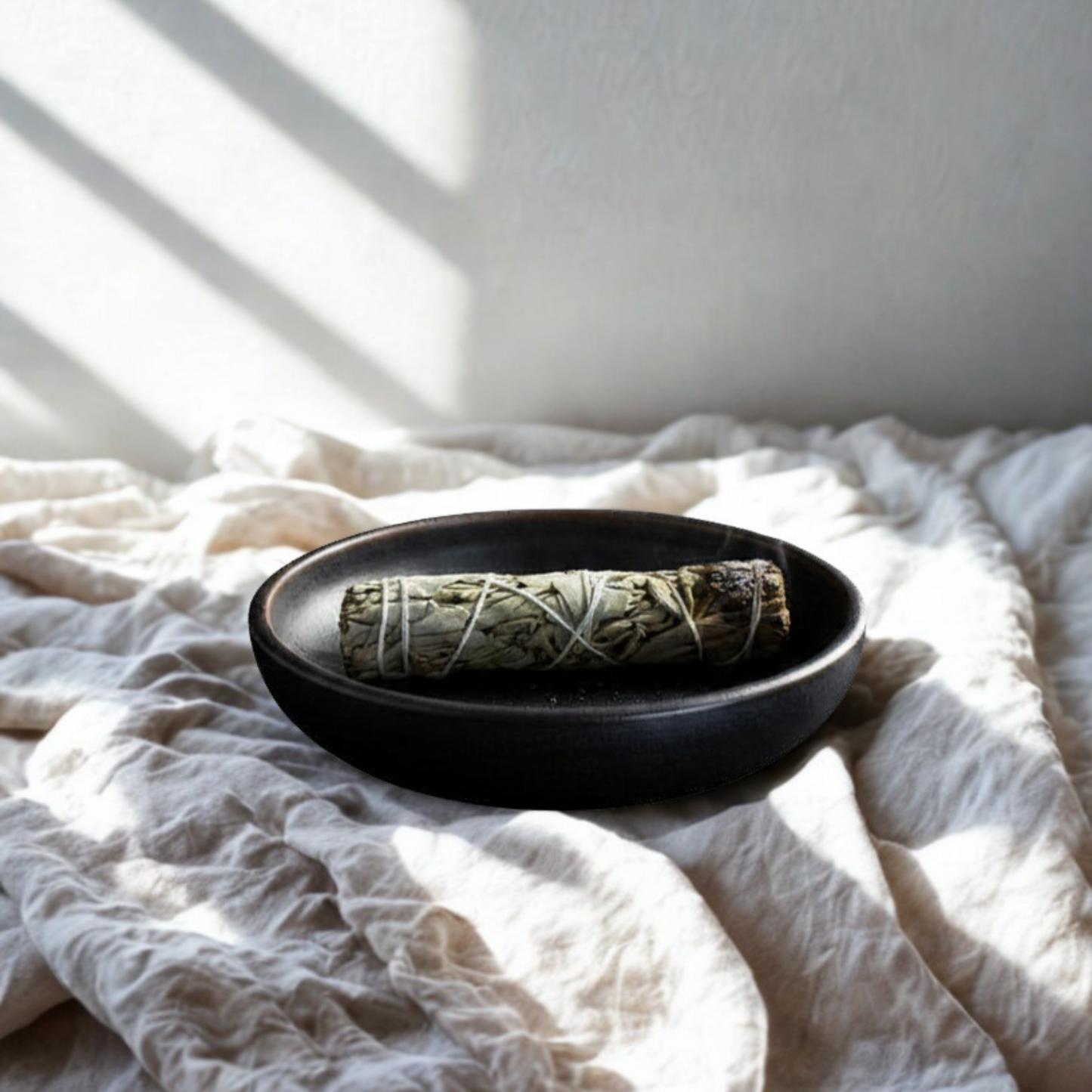 Sage smudge stick being used for smudging ritual, cleansing home energy and promoting calm and balance