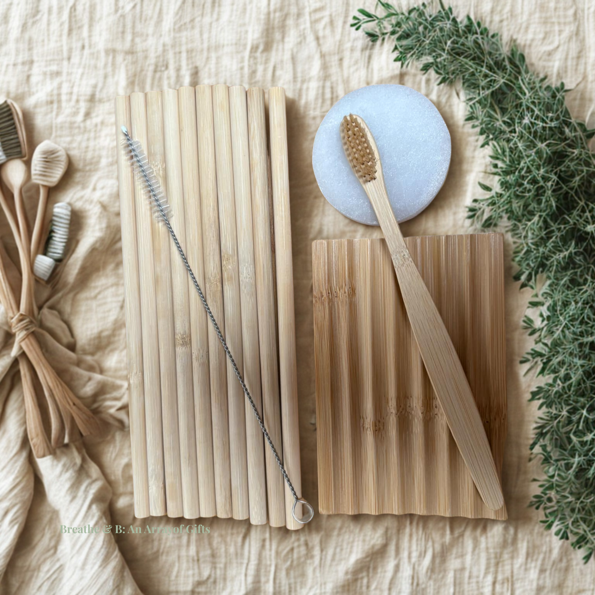 Set of bamboo straws, toothbrush, wooden soap dish and selenite plate on  a light background